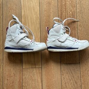 Air Jordan white sneakers white blue and hot pink.  Velcro closure & laces.